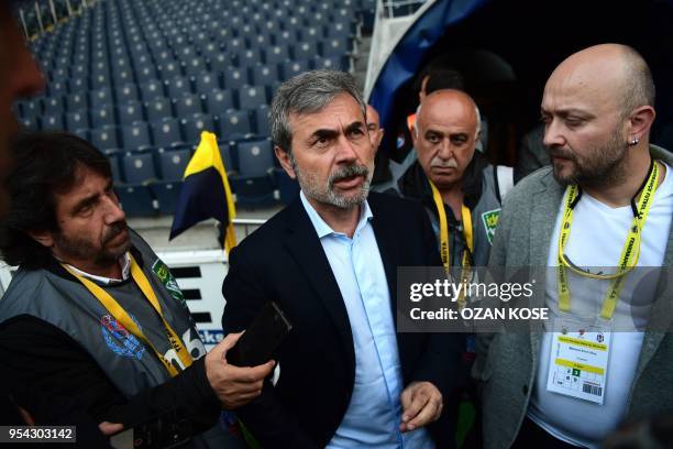 Fenerbahce's head coach Aykut Kocaman speaks to media members prior to the rescheduled Turkish Cup semi second leg final football match between...
