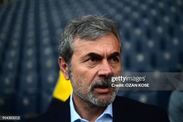 Fenerbahce's head coach Aykut Kocaman speaks to journalists prior to the rescheduled Turkish Cup semi second leg final football match between...