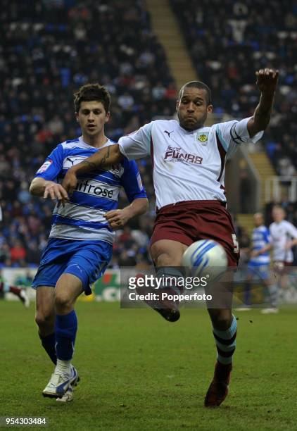 Shane Long of Reading and Clarke Carlisle of Burnley battle for the ball during the npower Championship match between Reading and Burnley at the...