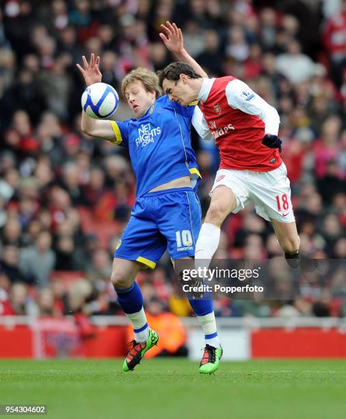 Sebastien Squillaci of Arsenal and Luciano Becchio of Leeds United battling for the ball during the FA Cup sponsored by E.ON 3rd Round match between...