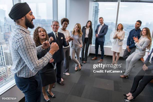 team building in a high-rise city office - team building activity stock pictures, royalty-free photos & images