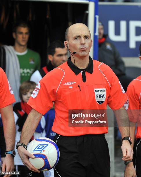 Referee Mike Dean walking on to the pitch ahead of the FA Cup sponsored by E.ON 3rd Round match between between Leicester City and Manchester City at...