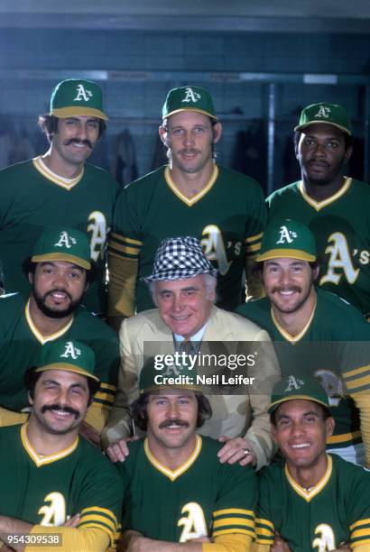 Portrait of Oakland Athletics owner Charlie Finley with players Rollie Fingers , Joe Rudi , Vida Blue , Gene Tenace , Bert Campaneris , Jim Catfish...