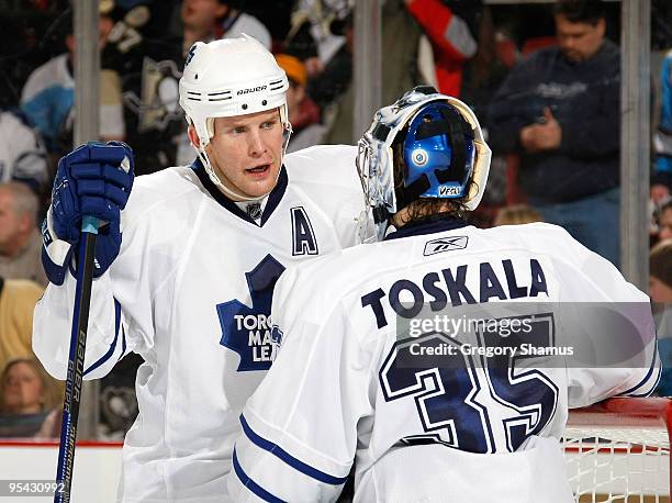 Mike Komisarek of the Toronto Maple Leafs talks with Vesa Toskala against the Pittsburgh Penguins on December 27, 2009 at Mellon Arena in Pittsburgh,...