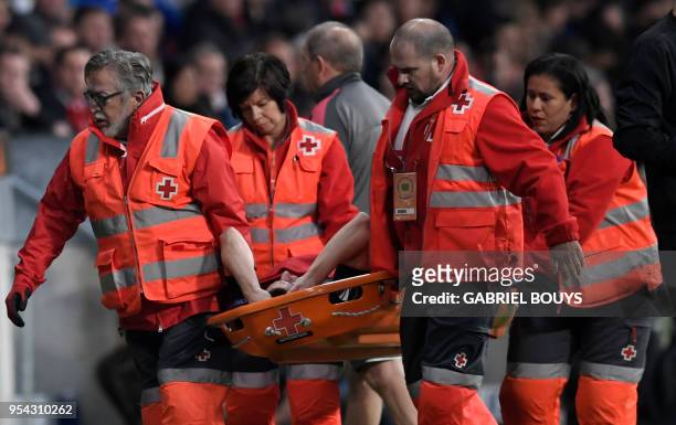 Arsenal's French defender Laurent Koscielny is carried on a stretcher during the UEFA Europa League semi-final second leg football match between Club...