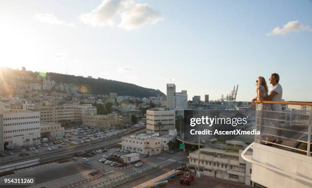 couple look out at haifa from cruise ship view point - cruise deck stock pictures, royalty-free photos & images