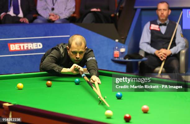 Barry Hawkins in action during his semi-final match against Mark Williams, on day thirteen of the 2018 Betfred World Championship at The Crucible,...