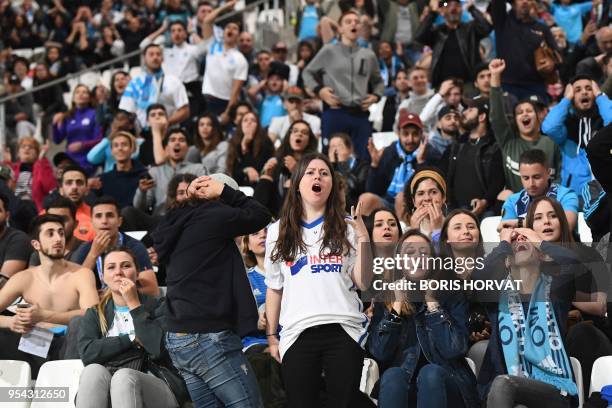 Olympique de Marseille fans react as they watch the Europa League semi-final football match Salzburg against Marseille on May 3, 2018 at the...