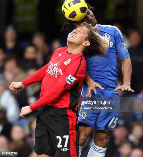 Florent Malouda of Chelsea and Michel Salgado of Blackburn battle for a high ball during the Barclays Premier League match between Chelsea and...