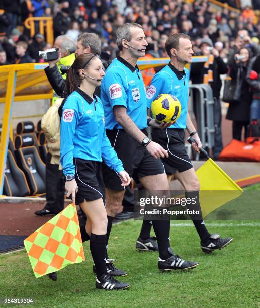 The refereeing team, including assistant referee Sian Massey and referee Martin Atkinson , ahead of the Barclays Premier League match between...