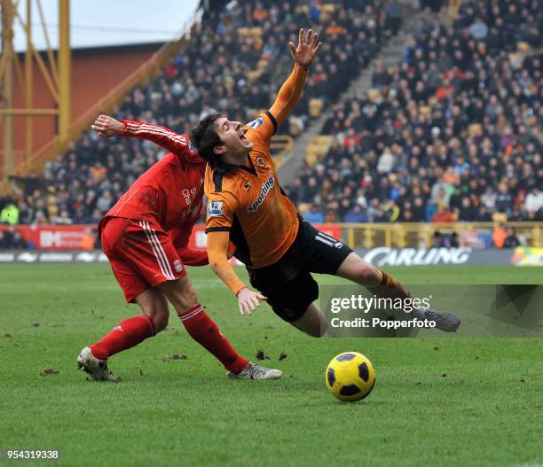 Stephen Ward of Wolverhampton goes down after being tackled by Fernando Torres of Liverpool during the Barclays Premier League match between...