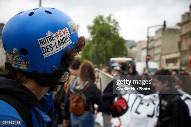 Demonstrator wears an helmet with a sticker reading 'Notre rêve des Landes'. Several sectors on strike called to a protest and a gathering in front...