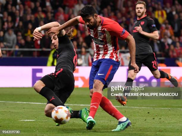 Atletico Madrid's Spanish forward Diego Costa shoots to score a goal during the UEFA Europa League semi-final second leg football match between Club...