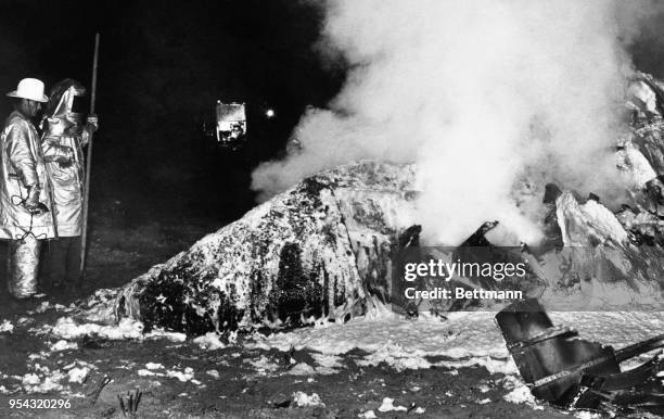 Emergency services at the site of a Boeing B-52 Stratofortress crash at Faro, 12 miles north of Goldsboro, North Carolina, USA, on the night of...