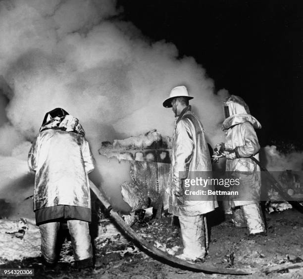Emergency services at the site of a Boeing B-52 Stratofortress crash at Faro, 12 miles north of Goldsboro, North Carolina, USA, on the night of...
