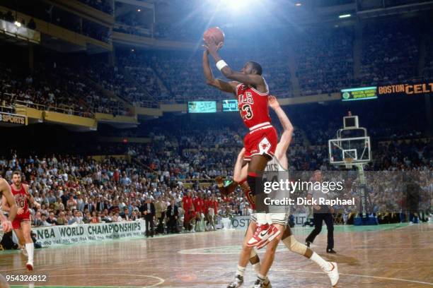 Michael Jordan of the Chicago Bulls shoots the ball against the Boston Celtics circa 1986 at the Boston Garden in Boston, Massachusetts. NOTE TO...