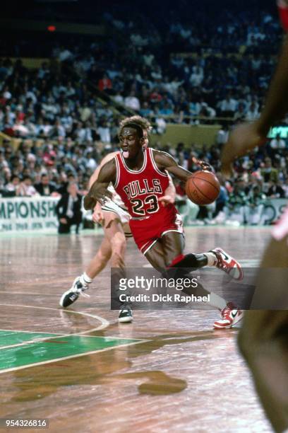 Michael Jordan of the Chicago Bulls handles the ball against the Boston Celtics circa 1986 at the Boston Garden in Boston, Massachusetts. NOTE TO...