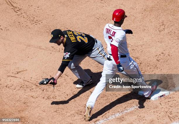 Washington Nationals center fielder Michael Taylor is out by a step to Pittsburgh Pirates third baseman David Freese during a MLB game between the...