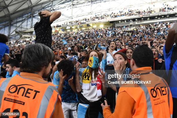 Olympique de Marseille fans react as they watch the Europa League semi-final football match Salzburg against Marseille on May 3, 2018 at the...