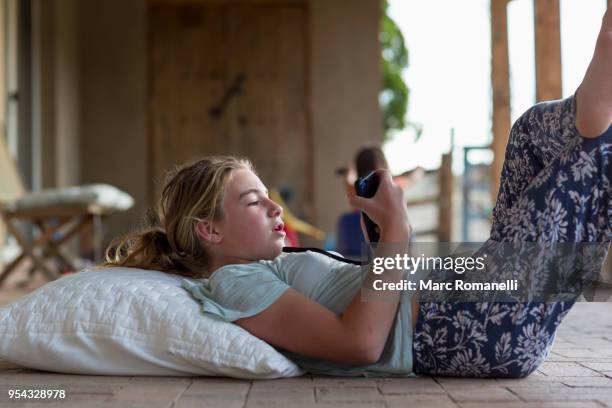 12 year old girl listening to music - lamy new mexico stock pictures, royalty-free photos & images