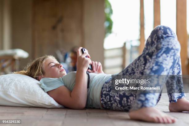 12 year old girl listening to music - lamy new mexico stock pictures, royalty-free photos & images