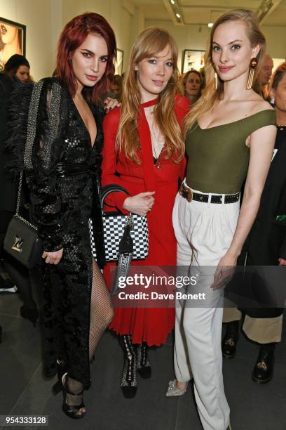 Nikita Andrianova, guest and Dioni Tabbers attend a private view of photographer Ellen von Unwerth's exhibition "Ladyland" at Opera Gallery on May 3,...