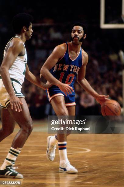 Walt Frazier of the New York Knicks handles the ball against the Boston Celtics circa 1972 at the Boston Garden in Boston, Massachusetts. NOTE TO...