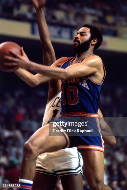 Walt Frazier of the New York Knicks goes to the basket against the Boston Celtics circa 1972 at the Boston Garden in Boston, Massachusetts. NOTE TO...