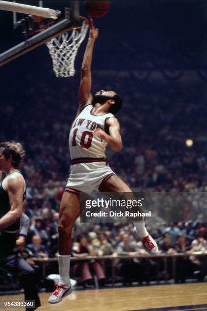 Walt Frazier of the New York Knicks goes to the basket against the Boston Celtics circa 1972 at Madison Square Garden in New York City, New York....