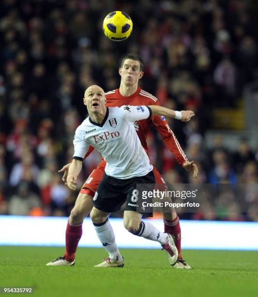 Daniel Agger of Liverpool and Andrew Johnson of Fulham in action during the Barclays Premier League match between Liverpool and Fulham at Anfield on...