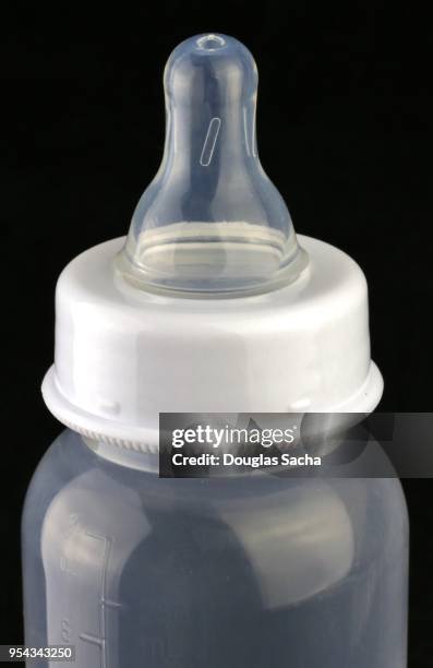 close-up of a plastic baby bottle - electrolyte stock pictures, royalty-free photos & images