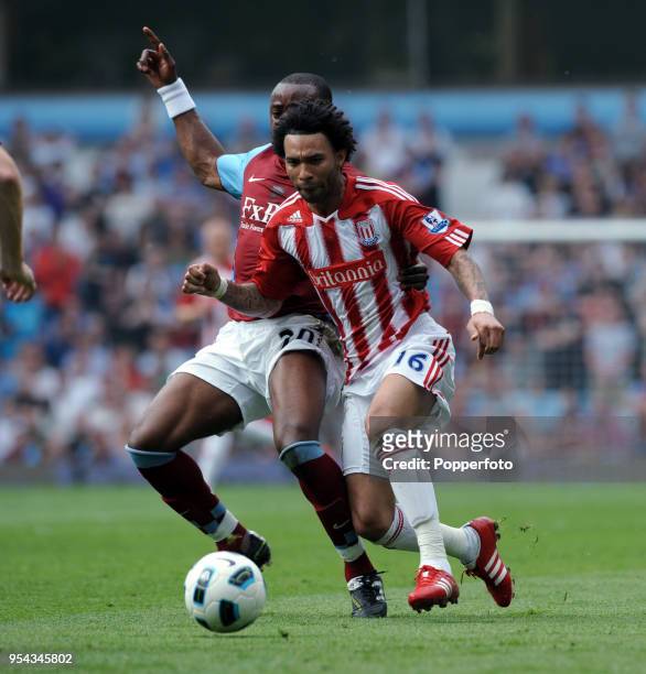 Jermaine Pennant of Stoke City and Nigel Reo Coker of Aston Villa in action during the Barclays Premier League match between Aston Villa and Stoke...
