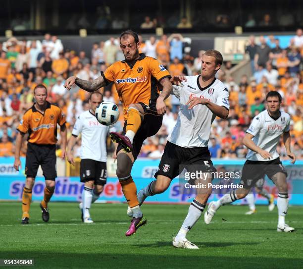 Stephen Fletcher of Wolverhampton Wanderers and Brede Hangeland of Fulham in action during the Barclays Premier League match between Wolverhampton...