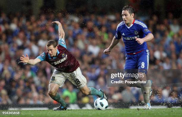 Frank Lampard of Chelsea and Jonathan Spector of West Ham in action during the Barclays Premier League match between Chelsea and West Ham United at...