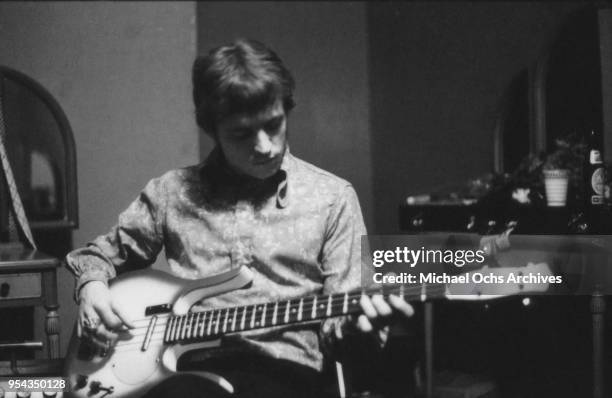 Jack Bruce of the rock band 'Cream' plays a Danelectro longhorn bass guitar at the 'Strange Brew' recording session at Atlantic Recording Studios on...