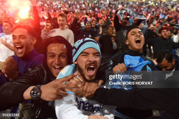 Olympique de Marseille fans react as they watch the Europa League semi-final football match Salzburg against Marseille on May 3, 2018 at the...