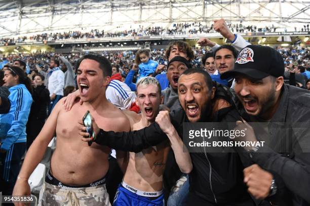 Olympique de Marseille fans react after victory of their team in the Europa League semi-final football match Salzburg against Marseille on May 3,...