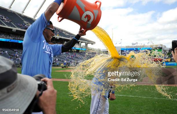 Salvador Perez of the Kansas City Royals douses Alex Gordon with Gatorade as they celebrate a 10-6 win over the Detroit Tigers at Kauffman Stadium on...