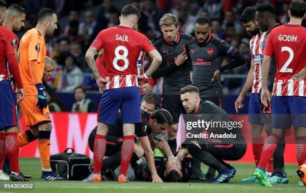 Laurent Koscielny of Arsenal is seen after he was injured during the UEFA Europa League semi final return match between Atletico Madrid and Arsenal...