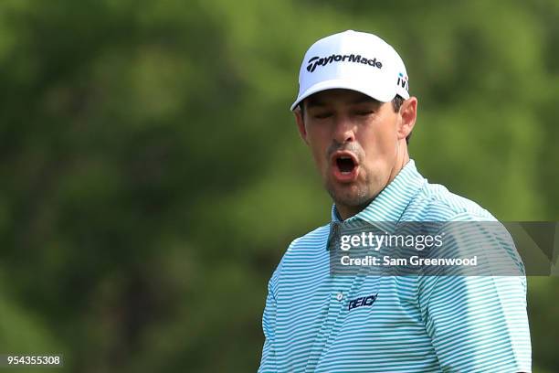 Johnson Wagner reacts after a putt attempt on the ninth green during the first round of the 2018 Wells Fargo Championship at Quail Hollow Club on May...