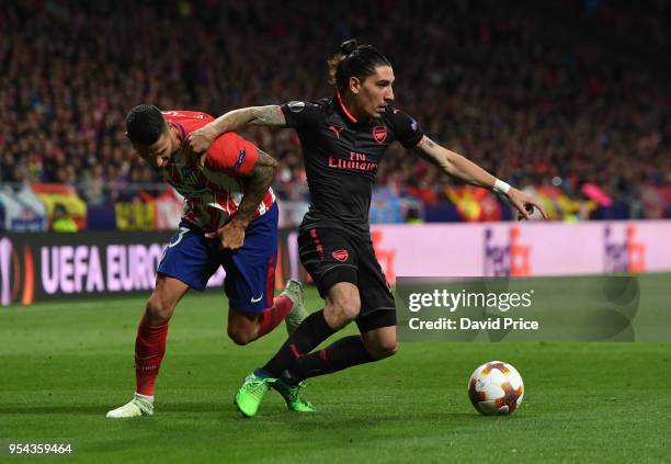Hector Bellerin of Arsenal takes on Vitolo of Atletico during the UEFA Europa League Semi Final second leg match between Atletico Madrid and Arsenal...