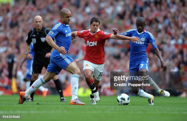 Javier Hernandez of Manchester United is challenged by Alex and Ramires of Chelsea during the Barclays Premier League match between Manchester United...