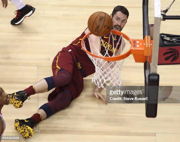 Cleveland Cavaliers center Kevin Love falls to the floor after making an off balance throw as the Toronto Raptors play the Cleveland Cavaliers in the...