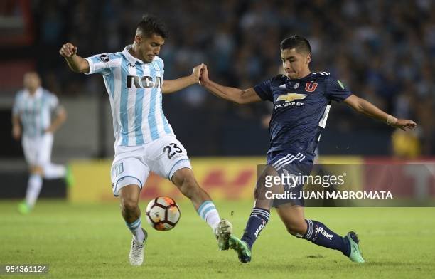 Chile's Universidad de Chile forward Nicolas Guerra vies for the ball with Argentina's Racing Club defender Alexis Soto during their Copa...