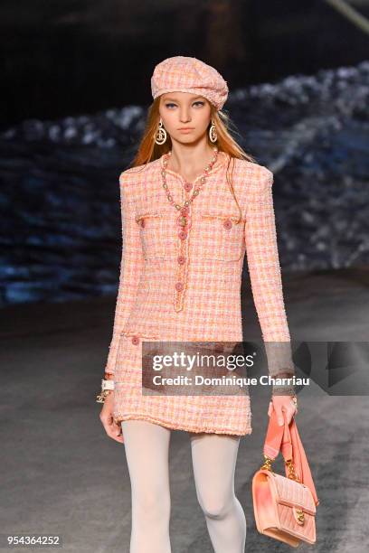 Model walks the runway during the Chanel Cruise 2018/2019 Collection at Le Grand Palais on May 3, 2018 in Paris, France.