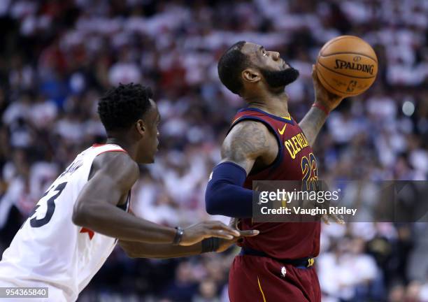 LeBron James of the Cleveland Cavaliers catches a pass as Pascal Siakam of the Toronto Raptors defends in the second half of Game One of the Eastern...