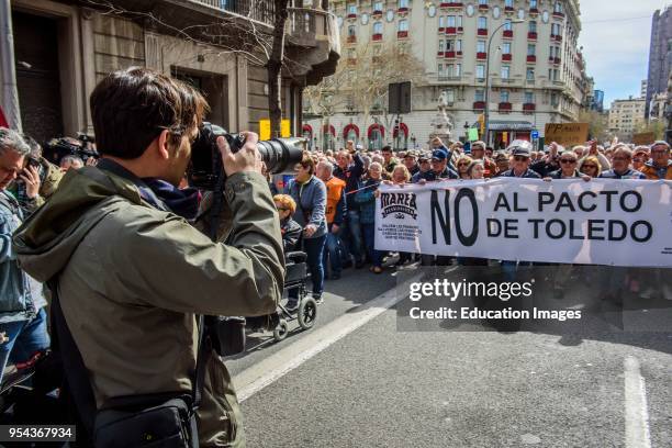 Photographer in the demonstration for fair pensions. Pensioners and young people from all around Spain took part in a nationwide demonstration to...
