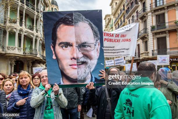 Barcelona, Catalonia, Spain. 18nd Mar, 2018. A photo of Albert Rivera and Mariano Rajoy as the same person in the demonstration for fair pensions....