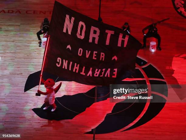 The Raptor waves the team flag as the Toronto Raptors play the Cleveland Cavaliers in the second round of the NBA playoffs at the Air Canada Centre...