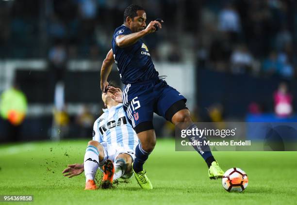 Jean Beausejour of Universidad de Chile fights for the ball with Renzo Saravia of Racing Club during a group stage match between Racing Club and...